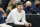 Utah Jazz owner Ryan Smith looks on before the start of their NBA basketball game against the Indiana Pacers Thursday, Nov. 11, 2021, in Salt Lake City. (AP Photo/Rick Bowmer)