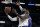 Los Angeles Lakers forward LeBron James, left, gets past to shoot against Detroit Pistons guard Hamidou Diallo, right, during the first half of an NBA basketball game Sunday, Nov. 28, 2021, in Los Angeles. (AP Photo/Alex Gallardo)