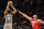 Brooklyn Nets guard James Harden (13) shoots a three point basket as Houston Rockets guard Eric Gordon defends during the first half of an NBA basketball game, Wednesday, Dec. 8, 2021, in Houston. (AP Photo/Eric Christian Smith)