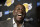 FILE - In this April 9, 2019, file photo, Magic Johnson speaks to reporters prior to an NBA basketball game between the Los Angeles Lakers and the Portland Trail Blazer in Los Angeles. Johnson might actually miss the Lakers if he was not always checking up on them. Johnson quit as the team's president of basketball operations at the end of the last season, leaving him out of a gym, but not out of the loop, as Los Angeles opened training camp. (AP Photo/Mark J. Terrill, File)