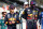ABU DHABI, UNITED ARAB EMIRATES - DECEMBER 12: Max Verstappen of Netherlands and Red Bull Racing and Sergio Perez of Mexico and Red Bull Racing stand on the grid prior to the F1 Grand Prix of Abu Dhabi at Yas Marina Circuit on December 12, 2021 in Abu Dhabi, United Arab Emirates. (Photo by Mark Thompson/Getty Images)