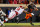STILLWATER, OK - NOVEMBER 27:  Quarterback Spencer Sanders #3 of the Oklahoma State Cowboys dodges defensive lineman Perrion Winfrey #8 of the Oklahoma Sooners in the fourth quarter at Boone Pickens Stadium on November 27, 2021 in Stillwater, Oklahoma.  The Cowboys won 'Bedlam' 37-33.  (Photo by Brian Bahr/Getty Images)