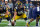 INDIANAPOLIS, IN - DECEMBER 04: Iowa Hawkeyes offensive lineman Tyler Linderbaum (65) points downfield during the Big Ten Championship Game between the Iowa Hawkeyes and the Michigan Wolverines on December 04, 2021, at Lucas Oil Stadium, in Indianapolis, IL. (Photo by Robin Alam/Icon Sportswire via Getty Images)