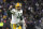 Green Bay Packers quarterback Aaron Rodgers (12) reacts to throwing a fourth quarter touchdown in an NFL football game against the Baltimore Ravens, Sunday, Dec. 19, 2021, in Baltimore. (AP Photo/Terrance Williams)