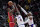 Chicago Bulls forward DeMar DeRozan, left, shoots over Los Angeles Lakers guard Rajon Rondo (4) and forward Carmelo Anthony, right, during the first half of an NBA basketball game in Chicago, Sunday, Dec. 19, 2021. (AP Photo/Nam Y. Huh)