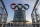 BEIJING, CHINA - DECEMBER 11: Visitors walk near a column with the Olympic Rings as they visit the top level of the Olympic Tower in the Olympic Green near the National Stadium, also known as the Bird's Nest, on December 11, 2021 in Beijing, China. The area will host a number of events for the Beijing 2022 Winter Olympic Games, including the opening ceremonies, which is set to open on February 4, 2022. (Photo by Kevin Frayer/Getty Images)