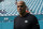 New York Jets head coach Robert Saleh watches the team warm up before an NFL football game against the Miami Dolphins, Sunday, Dec. 19, 2021, in Miami Gardens, Fla. (AP Photo/WIlfredo Lee)