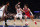 Detroit Pistons guard Cade Cunningham (2) drives to the basket against New York Knicks guard Evan Fournier (13) during the first half of an NBA basketball game,Tuesday, Dec. 21, 2021 in New York. (AP Photo/Noah K. Murray)