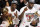 FILE - In this June 22, 2012, file photo, The Miami Heat's Dwyane Wade holds the the Larry O'Brien NBA Championship Trophy and LeBron James holds his most valuable player trophy after Game 5 of the NBA finals basketball series against the Oklahoma City Thunder, in Miami. LeBron James and Dwyane Wade match up for probably the final time in their careers when the Lakers host the Heat, Monday night, Dec. 10, 2018, in Los Angeles. The NBA icons came into the league in 2003 and teamed up to win two championships while reaching four NBA Finals together in Miami. (AP Photo/Lynne Sladky, File)