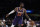 Phoenix Suns' Deandre Ayton dribbles the ball during first half of an NBA basketball game against the Los Angeles Lakers Tuesday, Dec. 21, 2021, in Los Angeles. (AP Photo/Jae C. Hong)