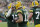 Green Bay Packers' Aaron Rodgers is congratulated by Allen Lazard after throwing career touchdown pass 443 during the first half of an NFL football game against the Cleveland Browns Saturday, Dec. 25, 2021, in Green Bay, Wis. The pass breaks the previous Green Bay Packers record held by Brett Favre. (AP Photo/Aaron Gash)