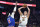 Denver Nuggets center Nikola Jokic (15) shoots against Golden State Warriors center Kevon Looney (5) during the first half of an NBA basketball game in San Francisco, Tuesday, Dec. 28, 2021. (AP Photo/Jeff Chiu)