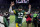 GREEN BAY, WISCONSIN - DECEMBER 25: Aaron Rodgers #12 of the Green Bay Packers walks off the field after beating the Cleveland Browns 24-22 at Lambeau Field on December 25, 2021 in Green Bay, Wisconsin. (Photo by Stacy Revere/Getty Images)
