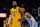 MEMPHIS, TENNESSEE - DECEMBER 29: Los Angeles Lakers forward LeBron James #6 and Memphis Grizzlies guard Ja Morant #12 during the first half at FedExForum on December 29, 2021 in Memphis, Tennessee. NOTE TO USER: User expressly acknowledges and agrees that, by downloading and or using this photograph, User is consenting to the terms and conditions of the Getty Images License Agreement.  (Photo by Justin Ford/Getty Images)