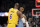 Los Angeles Lakers forward LeBron James (6) embraces Memphis Grizzlies guard Ja Morant (12) in the second half of an NBA basketball game Wednesday, Dec. 29, 2021, in Memphis, Tenn. (AP Photo/Nikki Boertman)
