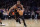 New York Knicks guard Kemba Walker (8) drives against the Atlanta Hawks during the second half of an NBA basketball game Saturday, Dec. 25, 2021, in New York. The Knicks won 101-87. (AP Photo/Adam Hunger)