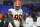 Cleveland Browns defensive end Jadeveon Clowney (90) looks on during pre-game warm-ups before an NFL football game against the Baltimore Ravens, Sunday, Nov. 28, 2021, in Baltimore. (AP Photo/Terrance Williams)