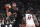 Portland Trail Blazers center Jusuf Nurkic shoots over Miami Heat forward PJ Tucker during the first half of an NBA basketball game in Portland, Ore., Wednesday, Jan. 5, 2022. (AP Photo/Amanda Loman)