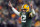 GREEN BAY, WISCONSIN - JANUARY 02: Quarterback Aaron Rodgers #12 of the Green Bay Packers celebrates after a touchdown during the 3rd quarter of the game against the Minnesota Vikings at Lambeau Field on January 02, 2022 in Green Bay, Wisconsin. (Photo by Patrick McDermott/Getty Images)
