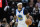 Golden State Warriors guard Gary Payton II (0) brings the ball up the court in the first half during an NBA basketball game against the Utah Jazz on Saturday, Jan. 1, 2022, in Salt Lake City. (AP Photo/Isaac Hale)