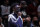 Former Tampa Bay Buccaneers wide receiver Antonio Brown looks on during the second half of an NBA basketball game between the Memphis Grizzlies and the Brooklyn Nets on Monday, Jan. 3, 2022, in New York. The Grizzlies won 118-104. (AP Photo/Adam Hunger)