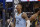 Memphis Grizzlies guard Ja Morant (12) reacts after scoring against the Golden State Warriors in the second half of an NBA basketball game Tuesday, Jan. 11, 2022, in Memphis, Tenn. (AP Photo/Brandon Dill)