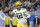 Green Bay Packers quarterback Aaron Rodgers (12) passes against the Detroit Lions in the first half during an NFL football game, Sunday, Jan. 9, 2022, in Detroit. (AP Photo/Rick Osentoski)
