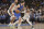 Dallas Mavericks guard Luka Doncic (77) handles the ball against Memphis Grizzlies guard Ja Morant (12) in the first half of an NBA basketball game Friday, Jan. 14, 2022, in Memphis, Tenn. (AP Photo/Brandon Dill)