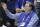 Former Kentucky coach Joe B. Hall waves to the crowd during the first half of the team's NCAA college basketball game against UAB in Lexington, Ky., Friday, Nov. 29, 2019. (AP Photo/James Crisp)