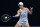 MELBOURNE, AUSTRALIA - JANUARY 17: Ashleigh Barty of Australia plays a forehand in her first round singles match against Lesia Tsurenko of Ukraine during day one of the 2022 Australian Open at Melbourne Park on January 17, 2022 in Melbourne, Australia. (Photo by Cameron Spencer/Getty Images)