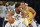 Utah Jazz guard Donovan Mitchell (45) is defended by Los Angeles Lakers guard Avery Bradley (20) during the second half of an NBA basketball game in Los Angeles, Monday, Jan. 17, 2022. The Lakers won 101-95. (AP Photo/Ringo H.W. Chiu)