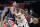 Denver Nuggets center Bol Bol (10) drives into Houston Rockets forward Kenyon Martin Jr. (6) during the second half of an NBA basketball game Saturday, Jan. 1, 2022, in Houston. (AP Photo/Michael Wyke)