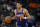 Phoenix Suns guard Devin Booker (1) moves the ball upcourt against the San Antonio Spurs during the second half of an NBA basketball game, Monday, Jan. 17, 2022, in San Antonio. (AP Photo/Eric Gay)