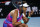 Naomi Osaka of Japan reacts during her third round match against Amanda Anisimova of the U.S. at the Australian Open tennis championships in Melbourne, Australia, Friday, Jan. 21, 2022. (AP Photo/Simon Baker)