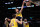 LOS ANGELES, CALIFORNIA - JANUARY 19: Domantas Sabonis #11 of the Indiana Pacers reacts as he dunks between Carmelo Anthony #7 and Austin Reaves #15 of the Los Angeles Lakers during the first half at Crypto.com Arena on January 19, 2022 in Los Angeles, California. NOTE TO USER: User expressly acknowledges and agrees that, by downloading and/or using this Photograph, user is consenting to the terms and conditions of the Getty Images License Agreement. Mandatory Copyright Notice: Copyright 2022 NBAE (Photo by Harry How/Getty Images)