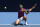 Rafael Nadal of Spain plays a backhand return to Denis Shapovalov of Canada during their quarterfinal match at the Australian Open tennis championships in Melbourne, Australia, Tuesday, Jan. 25, 2022. (AP Photo/Andy Brownbill)
