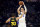 Dallas Mavericks center Kristaps Porzingis (6) shoots against Golden State Warriors guard Stephen Curry (30) during the first half of an NBA basketball game in San Francisco, Tuesday, Jan. 25, 2022. (AP Photo/Jed Jacobsohn)
