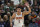 Phoenix Suns guard Devin Booker (1) reacts after scoring against the Utah Jazz in the first half during an NBA basketball game Wednesday, Jan. 26, 2022, in Salt Lake City. (AP Photo/Rick Bowmer)