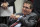 FILE - In this Thursday, Jan. 2, 2020, file photo, Washington Redskins owner Dan Snyder listens to head coach Ron Rivera during a news conference at the team's NFL football training facility, in Ashburn, Va. The NFL has fined the Washington Football Team $10 million and owner Dan Snyder is stepping away from day-to-day operations after an independent investigation into the organization’s workplace misconduct. The team was not stripped of any draft picks as part of the league’s discipline that was announced Thursday, July 1, 2021. (AP Photo/Alex Brandon, File)
