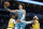 Charlotte Hornets guard LaMelo Ball (2) drives to the basket past Los Angeles Lakers forwards Stanley Johnson (14) and Carmelo Anthony (7) during the first half of an NBA basketball game in Charlotte, N.C., Friday, Jan. 28, 2022. (AP Photo/Jacob Kupferman)