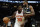 New York Knicks' Julius Randle drives past Milwaukee Bucks' Khris Middleton during the second half of an NBA basketball game Friday, Jan. 28, 2022, in Milwaukee. The Bucks won 123-108. (AP Photo/Morry Gash)