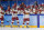 China's players celebrate victory during the women's preliminary round group B match of the Beijing 2022 Winter Olympic Games ice hockey competition between Denmark and China, at the Wukesong Sports Centre in Beijing on February 4, 2022. (Photo by Sebastien Bozon / AFP) (Photo by SEBASTIEN BOZON/AFP via Getty Images)