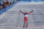 Russian athlete Alexander Bolshunov celebrates winning the gold medal during the men's 15km + 15km skiathlon cross-country skiing competition at the 2022 Winter Olympics, Sunday, Feb. 6, 2022, in Zhangjiakou, China. (AP Photo/Alessandra Tarantino)