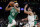 Boston Celtics' Derrick White (9) drives against Denver Nuggets' Facundo Campazzo during the first half of an NBA basketball game Friday, Feb. 11, 2022, in Boston. (AP Photo/Michael Dwyer)