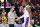MIAMI, FLORIDA - JANUARY 23: LeBron James #6 of the Los Angeles Lakers high fives head coach Frank Vogel against the Miami Heat at FTX Arena on January 23, 2022 in Miami, Florida. NOTE TO USER: User expressly acknowledges and agrees that, by downloading and or using this photograph, User is consenting to the terms and conditions of the Getty Images License Agreement.  (Photo by Michael Reaves/Getty Images)