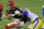 Los Angeles Rams defensive end Aaron Donald (99) tackles Cincinnati Bengals quarterback Joe Burrow (9) during the second half of the NFL Super Bowl 56 football game Sunday, Feb. 13, 2022, in Inglewood, Calif. The Los Angeles Rams won 23-20. (AP Photo/Ted S. Warren)