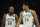 Milwaukee Bucks' Giannis Antetokounmpo (34) talks with Khris Middleton (22) during the first half of an NBA basketball game against the Indiana Pacers Tuesday, Feb. 15, 2022, in Milwaukee. (AP Photo/Aaron Gash)