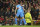 Atletico Madrid's Renan Lodi is congratulated by teammate Stefan Savic, left, after scoring his team's first goal during the Champions League round of 16, second leg soccer match between Manchester United and Atletico Madrid at Old Trafford, Manchester, England, Tuesday, March 15, 2022. (AP Photo/Dave Thompson)