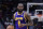 Los Angeles Lakers forward LeBron James (6) moves the ball down court in the first half of an NBA basketball game against the New Orleans Pelicans in New Orleans, Sunday, March 27, 2022. (AP Photo/Gerald Herbert)
