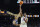 Kansas forward David McCormack (33) shoots over Villanova's Jermaine Samuels during the second half of a college basketball game in the semifinal round of the Men's Final Four NCAA tournament, Saturday, April 2, 2022, in New Orleans. (AP Photo/David J. Phillip)